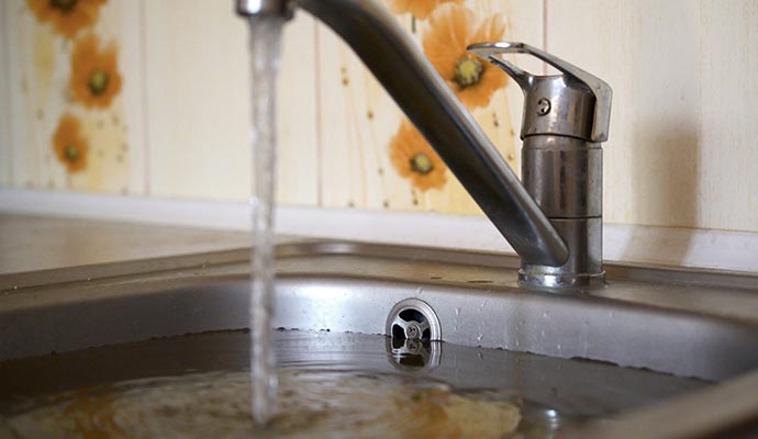 sink overflow tap water kitchen wall